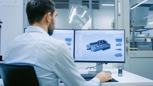 man looking at computer screen 