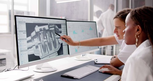 worker pointing at computer
